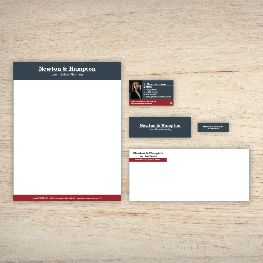 An example of Brand Identity Package on a wood panel background; which includes business card design, letterhead and email header, and an envelope.